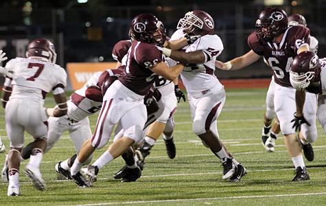 Senior offensive lineman Keenen Thomas blocks an Ennis defender during last Fridays game at Max Goldsmith Stadium. The Farmers look for their first win of the season on the road against Irving tonight.