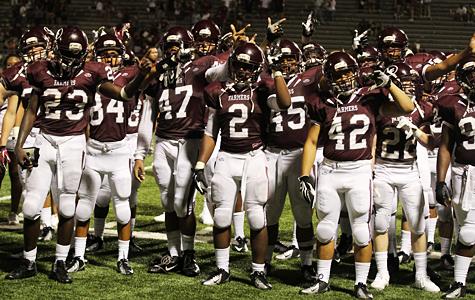 The Farmer varsity football team sings the school song after last weeks game against Plano. The Farmers take on Ennis tonight at home.