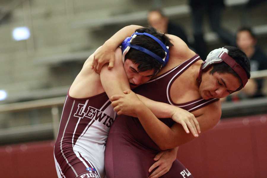 Sophomore Chris Hamill attempts to break free from his opponents hold on Dec. 12 against Plano Senior.