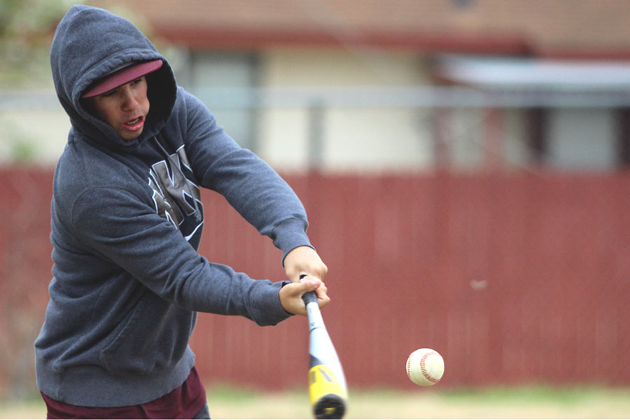 Junior Josh Mendez hits the ball during batting practice.