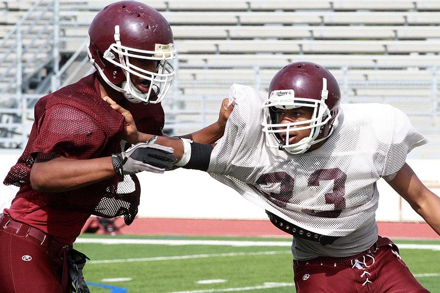 Kenneth Momah (33) tries to break free during a spring scrimmage on May 7. 