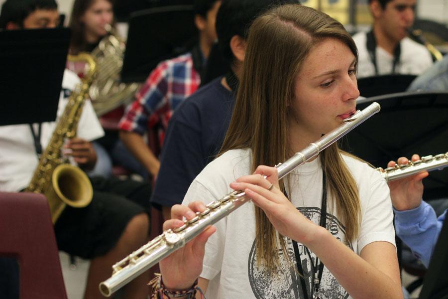 Freshman Isabelle Jakobi  plays her flute in band during a rehearsal. 