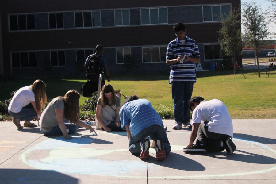 Students chalk the walk to prepare for homecoming Tuesday September 7. 