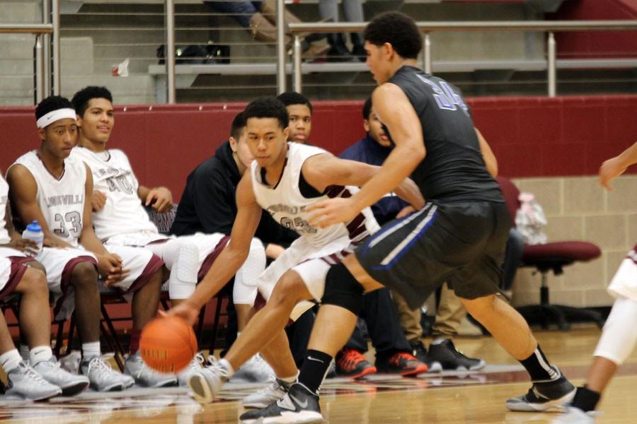 Junior Jeremiah Taylor drives past junior Tyler Davis of Plano West during the teams first meeting on Dec. 23.  