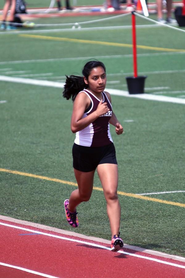Senior Anayeli Calixto races on the track on April 9 at Marcus hosted Track and Field Meet.