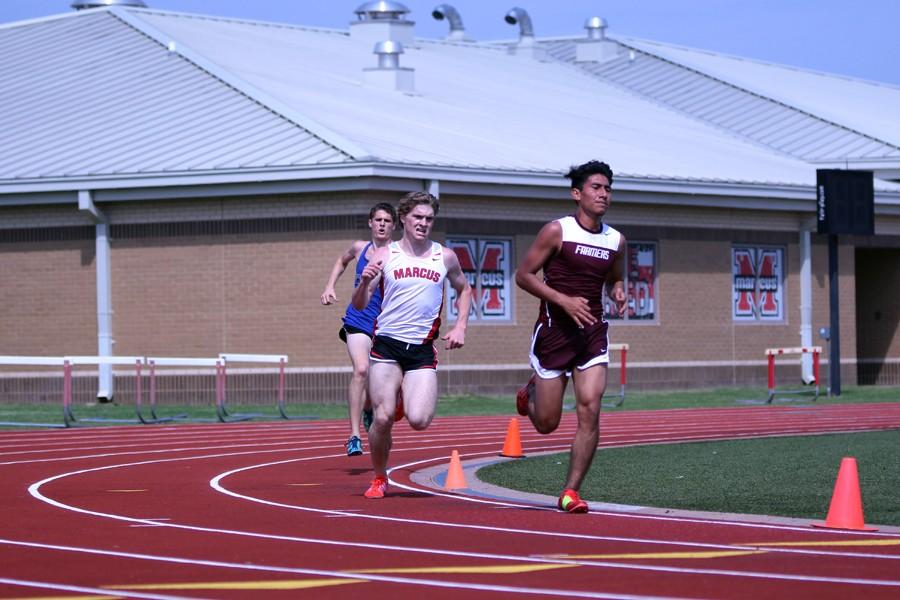 Junior Juan Calixto races to the finish line after the last bend at Marcus hosted Track and Field Meet on April 9.