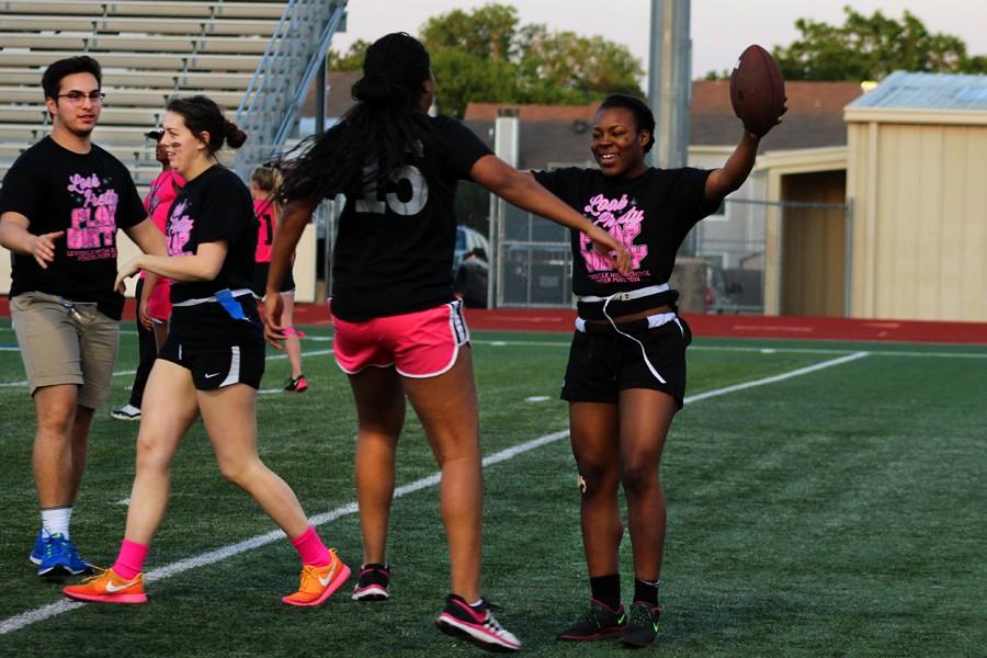 ___ and Jenae Hart move to embrace as they celebrate another touchdown at the April 20 Powderpuff game at Goldsmith Stadium.