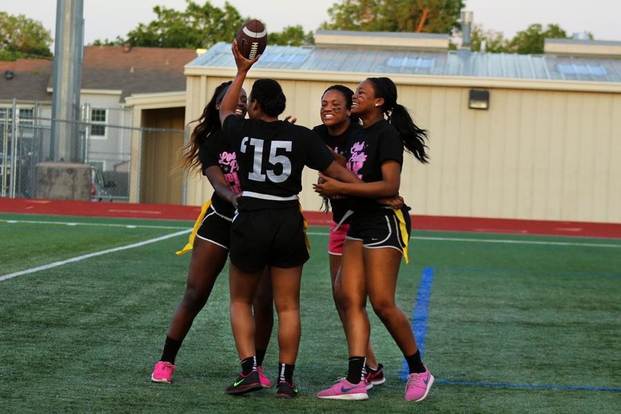 Senior Jessica Riles, Janae Hart, Janis ____, and ____ celebrate together a touchdown during the April 20 Powderpuff game.