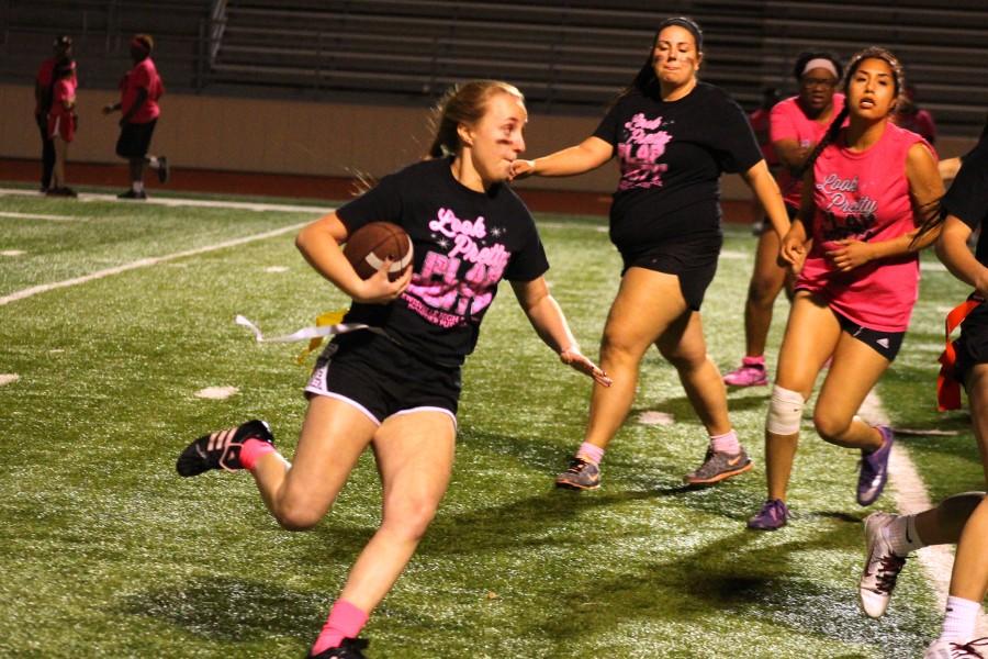Staci Rende rushes up the field with the ball at the April 20 Powderpuff game at Goldsmith Stadium.