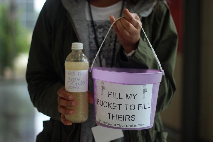 JWAC students have been walking around with buckets and water bottles like these urging students to help end the water problem. 