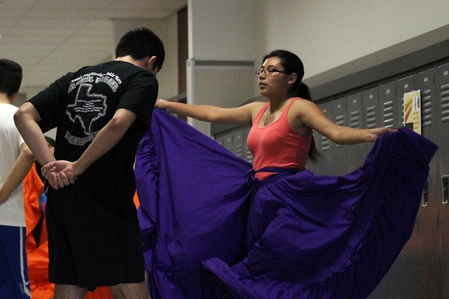 Krystlyn Moreno dances with her partner to practice for Lationo club event on May 1.  