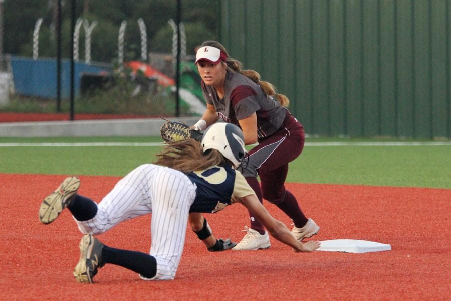 Junior second baseman Tommi Ann Goodman turns to tag a Keller runner in game 3 on Saturday in Argyle. The Farmers won 10-3 to return to the state tournament.