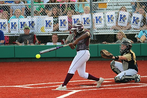 Aleecia Bell (27) connects with a pitch during game 2 against Keller on Friday night at Argyle High School. The Farmers lost the game, but won game 3 on Saturday, 10-3, to return to the state tournament.