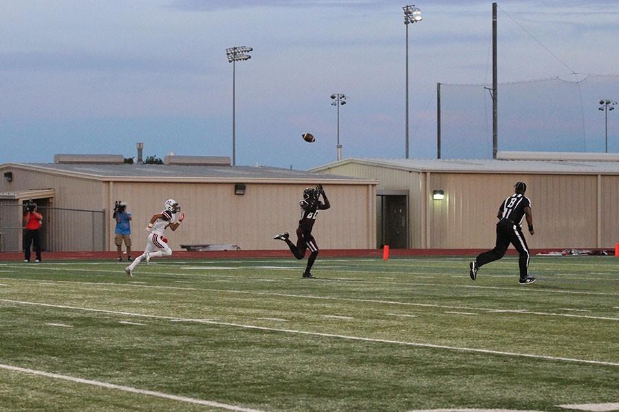Junior Tyrell Shavers (80) turns to catch the ball for the first touchdown of the game.