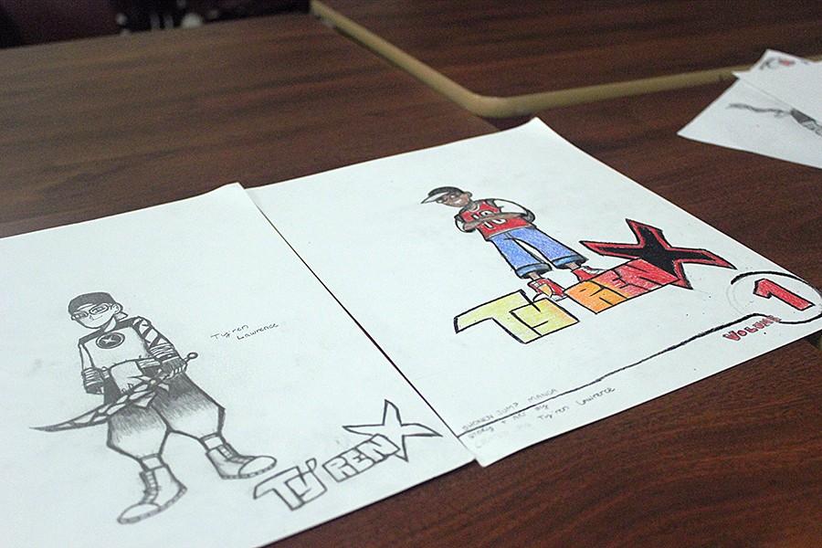 Junior Tyren Lawrence, anime club member, shows off his progress of his own manga series.