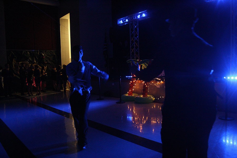 Two students kick off the dance by having a dance battle.