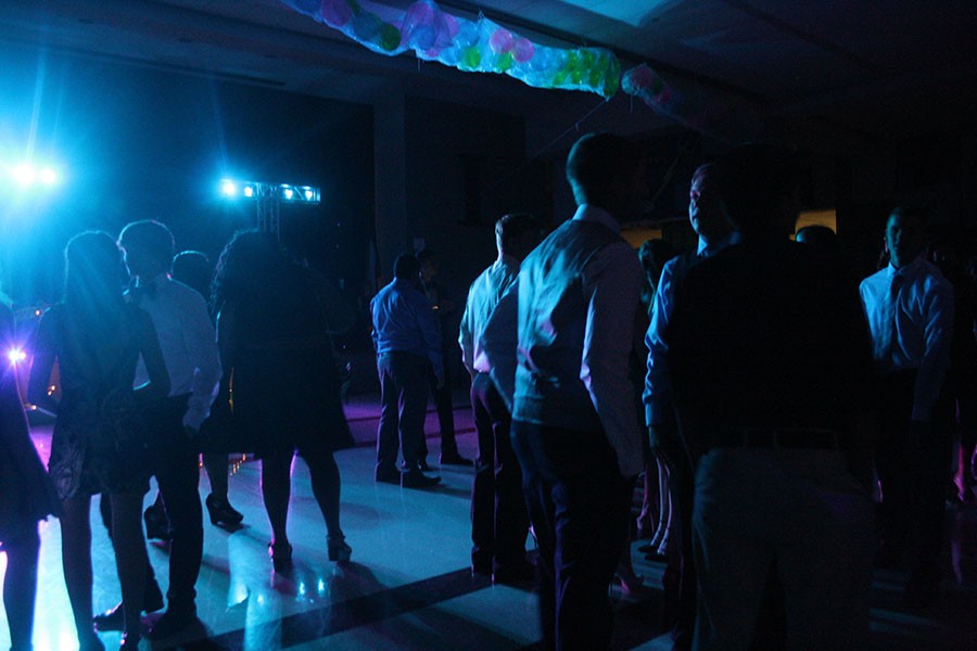 Students socialize as the dance gets started.
