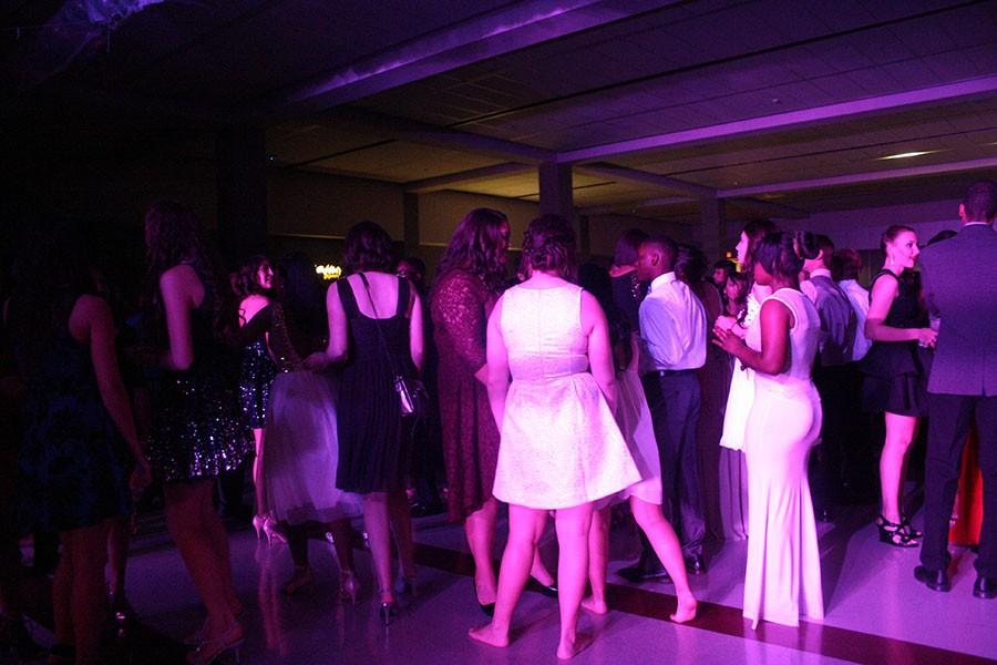 Students enjoy the dance as the music plays in the background.