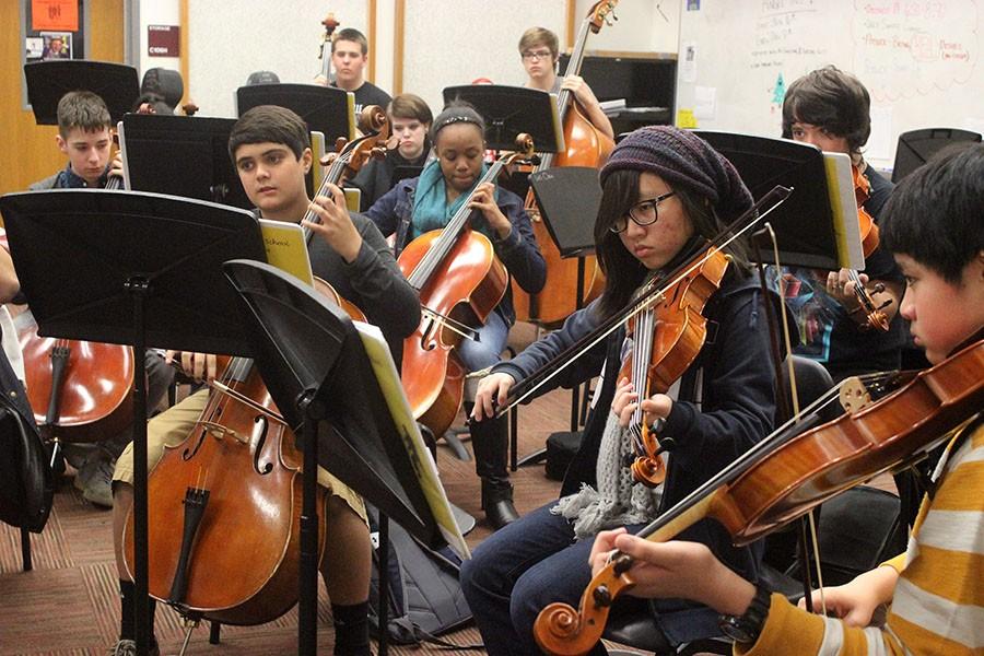Third period orchestra students prepare for their upcoming concert.