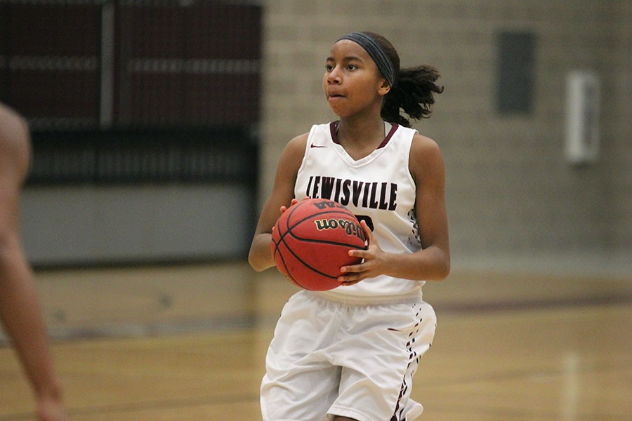 Freshman Anessa Boyd (12) stops to take  a shot during the game against Hebron on Jan. 19.