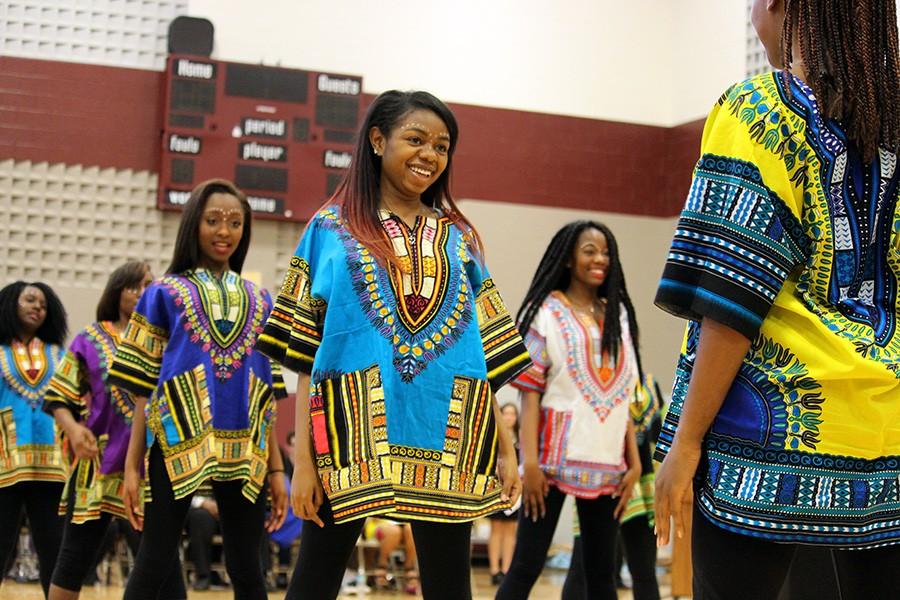 The Harmon African Dancers proudly exhibit their cultural fashion.