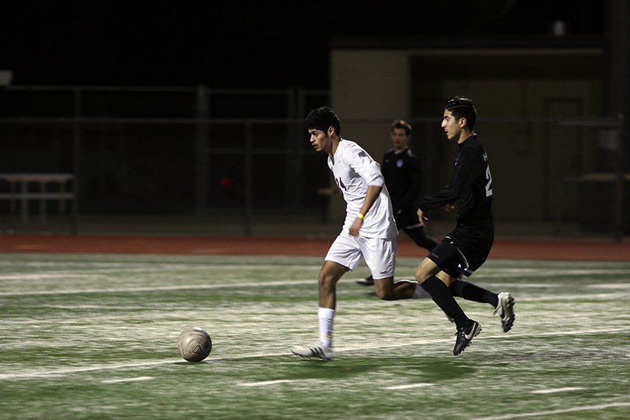 Christian Hernandez, (24) runs after the ball before a player on the opposing team, Hebron Hawks, at the game on February 24th.