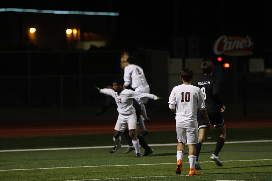 During the game against the Hebron Hawks on February 24th, Fabian Acosta, (10) watches team mates Mitchell Montenegro, (12) and Jonathan Lara, (8) jump for the ball. 