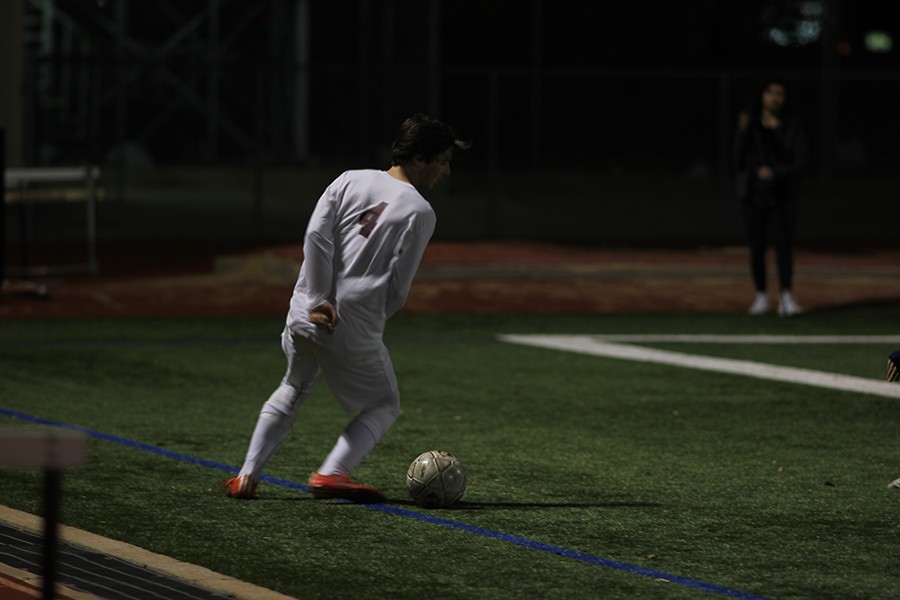 John Cronin (4) saves the ball just as it is about to to go out during the game on March 1st, against the Flowermound Jaguars