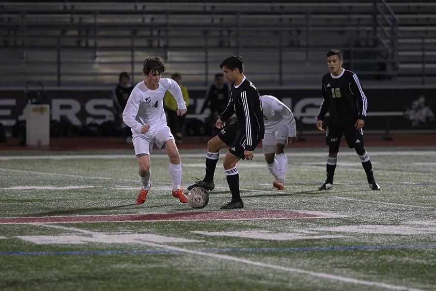 John Cronin, #4, runs up take the ball from a player on Plano East on the night of March 14