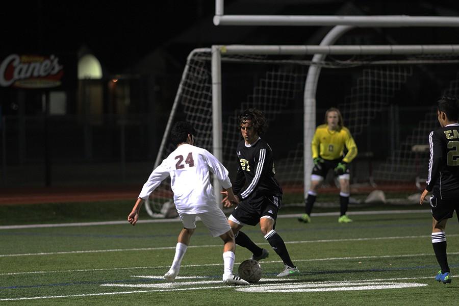Christian Hernandez, #24, dribbles around a player on the Plano East team to get to the goal on the night of March 14.