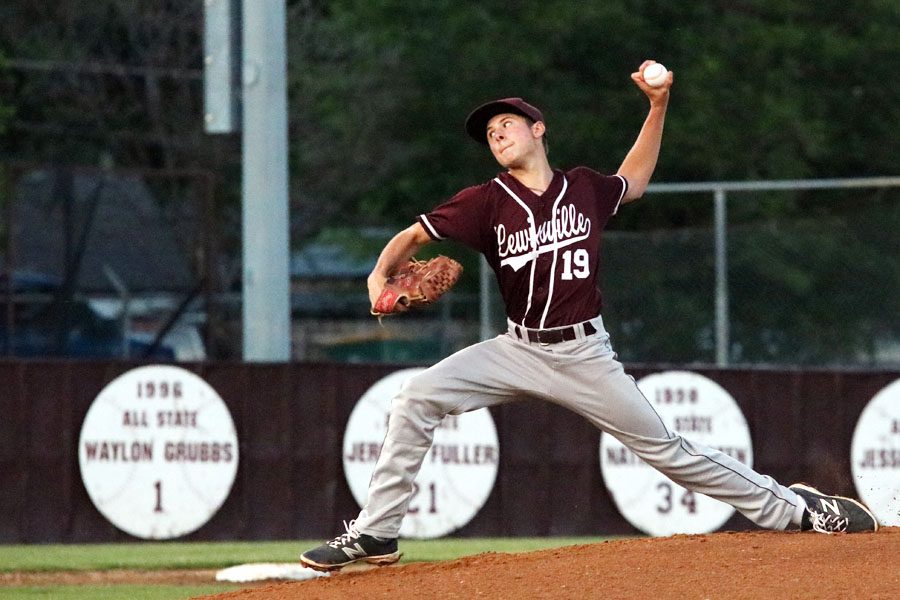 Starting pitcher junior Angelo Gennari pitches the ball to be hit by a Plano batter.