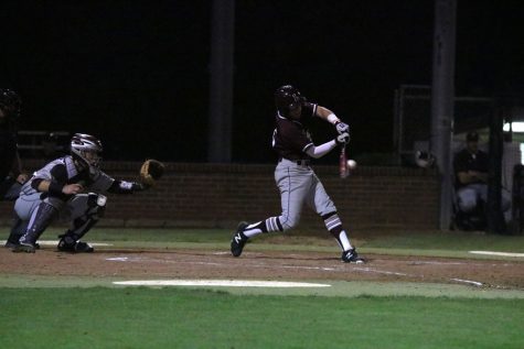 Junior Mason Holt swings at the ball during the home game on April 22 against Plano. 