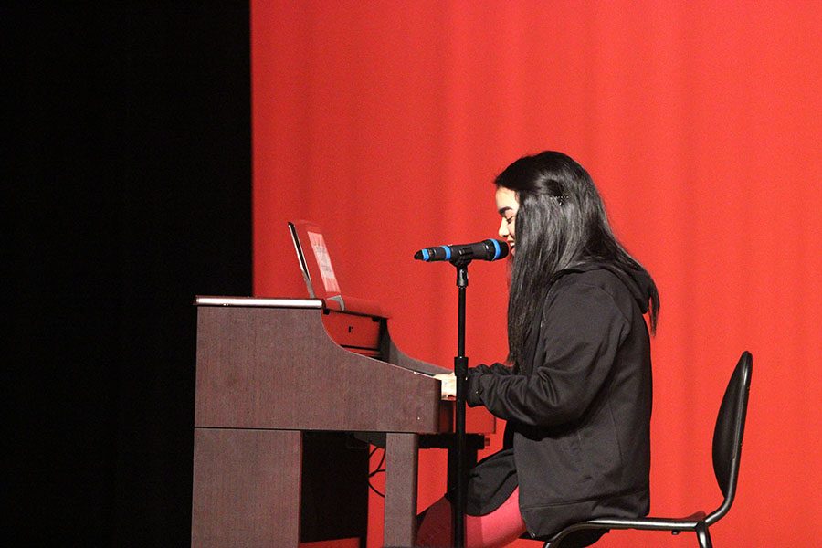 Senior Michaela Pinaroc sings a mashup while playing the piano.