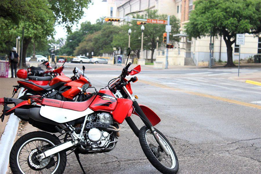 Student motorcycles parked along Guadalupe street off of campus.