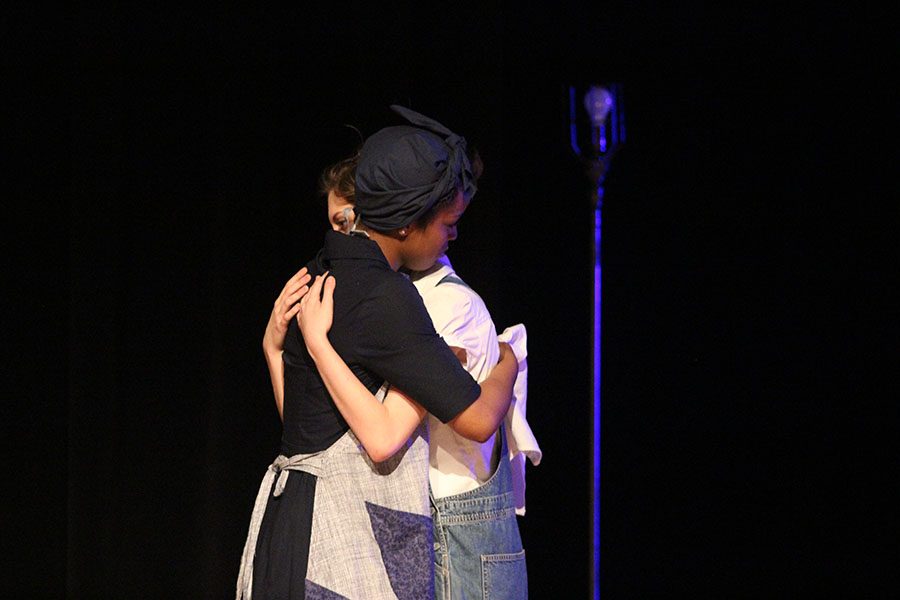 Calpurnia, played by senior Destinee Gines, comforts Scout, played by senior Ashlyn Eperjesi, during the hardships.