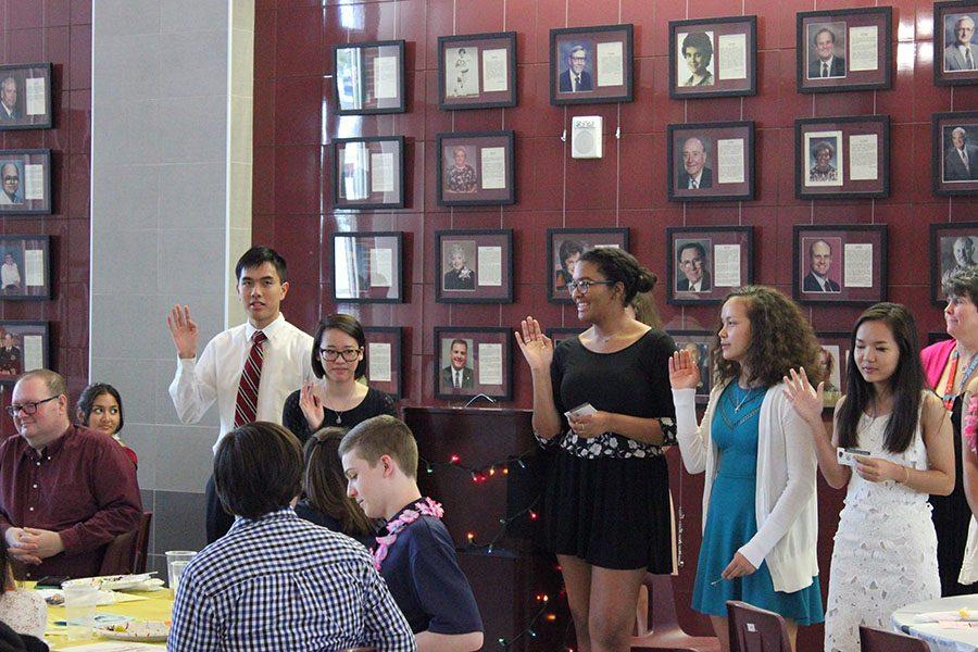 Junior Nathan Hoang, Madison Lam, Miriam Fisher, Kathryn Dean, and Dawt Sung pledge the oath for being inducted as senior officers.
