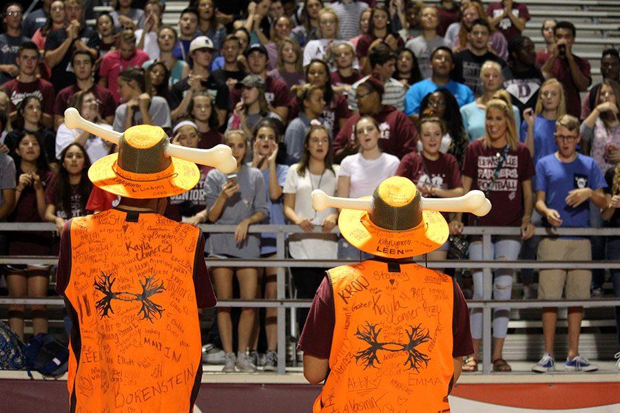 Boneheads Jarrell Lawrence and Juan Martinez prepare the Rowdy Crowd for the season during the first Thursday night yell on Aug. 25.