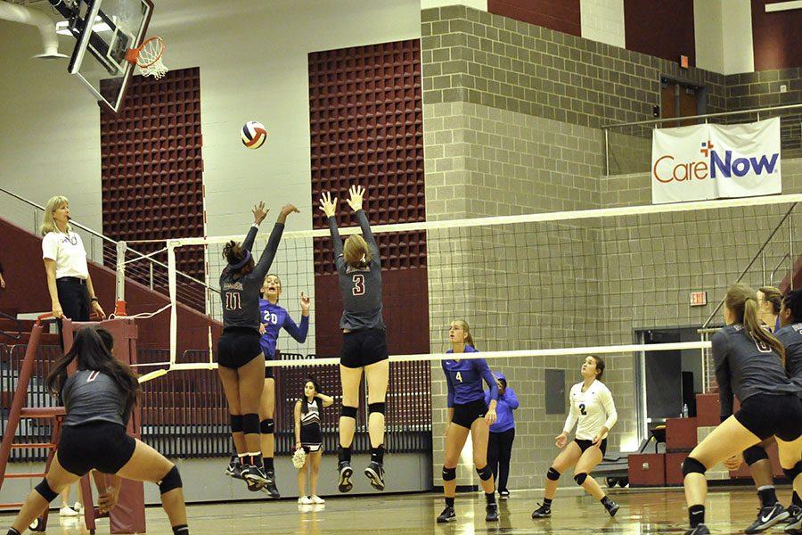 Senior Arianna Alvarez (7) and Senior Marie Hartsburg (8) take positon as Senior Jayda Gibson (11) and Sophomore Christina Cowsert get ready to block an incoming spike from a Hebron player.