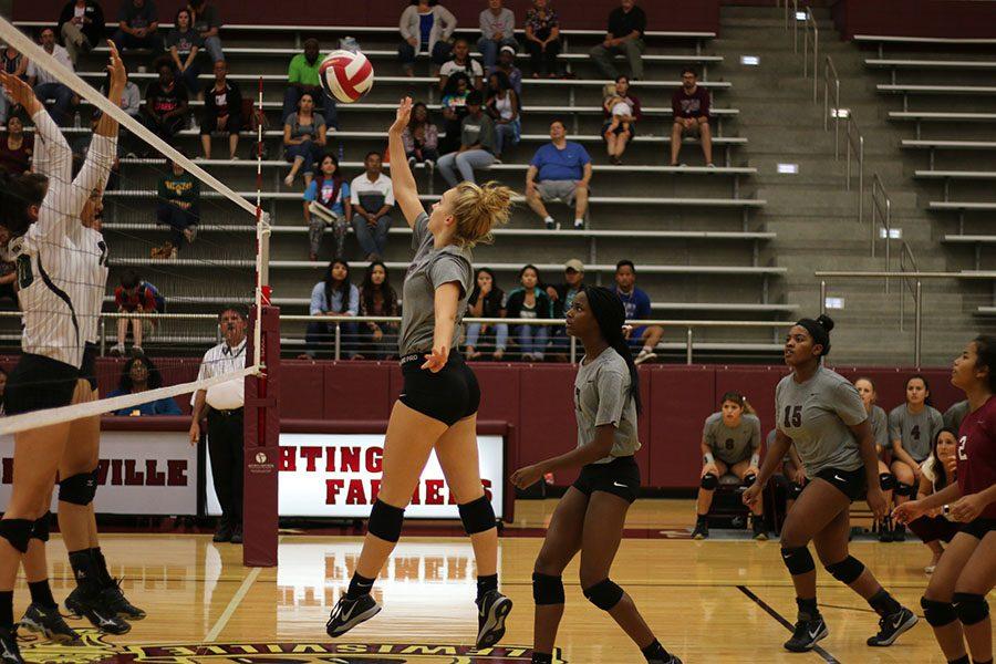 Junior Meredith Wagley spikes the ball during the home game against Lake Dallas on Friday, Sept. 2.
