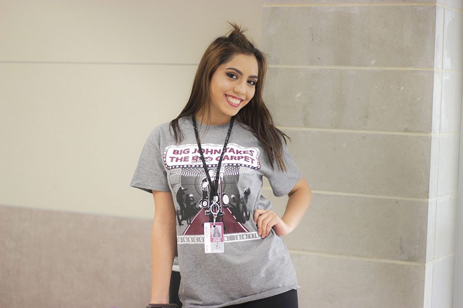 Senior Julysa Olvera shows off her coming T-shirt on Wednesday, Oct. 19.