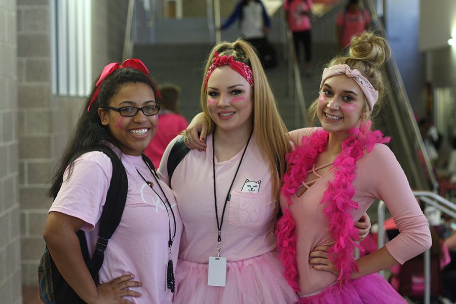 Seniors Jasmine Davidson, Danna Brown and Peyton Dillbeck show school spirit and dress head-to-toe in pink for breast cancer awareness month.  