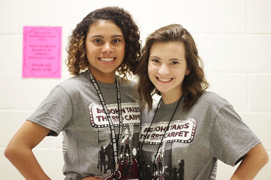 Sophomore Sierra Spivey and senior Sarah Stephens wear their homecoming T-shirts on Wednesday, Oct. 19.