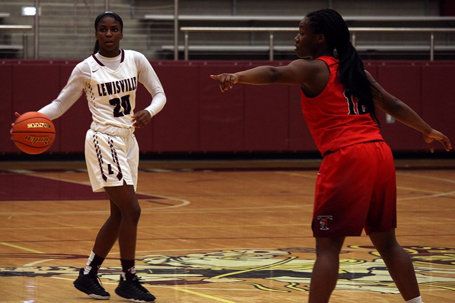 Captain Sharmaine Harper (20) looks for an open teammate to pass the ball to.