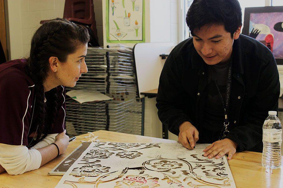 Art+teacher+Chana+Jayme+stays+after+school+to+help+sophomore+Christopher+Camilo+with+his+project.