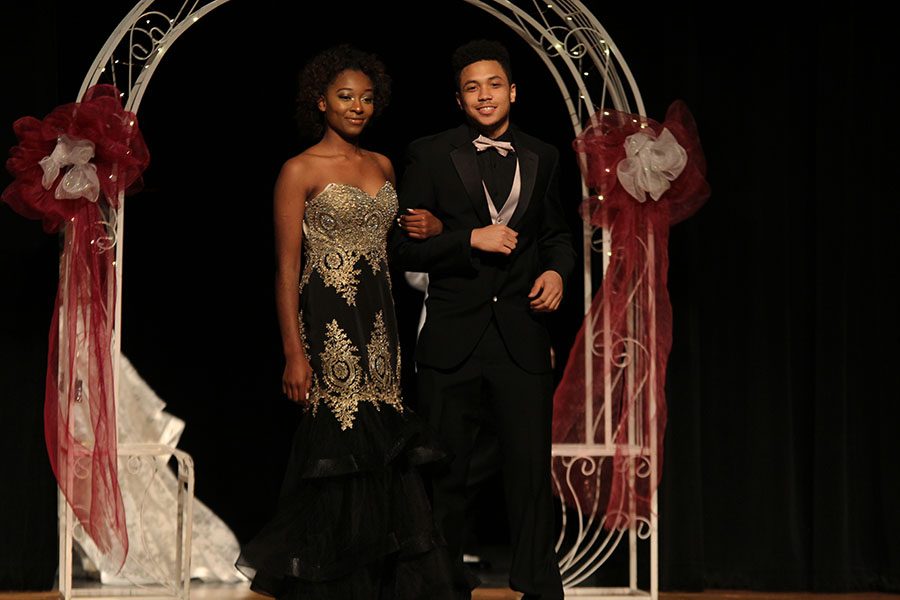 Juniors Bryson Evans and Nwanne Onuoha smile as they walk out hand in hand. 