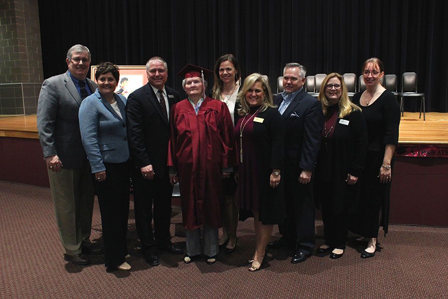 School board members pose with Frankie Sprabary after the ceremony.