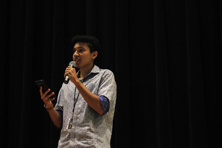 Junior Joseph Tauzin performs his short poem, The Track.