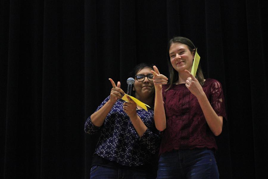 Juniors Jacquelyne Hernandez and Krista Anderson gesture to the audience after reciting their poem, Memes in the Eyes of an Angry Pepe.