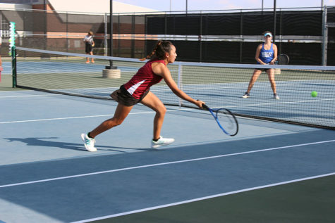 Sophomore Maritoni Songco reaches for the ball.