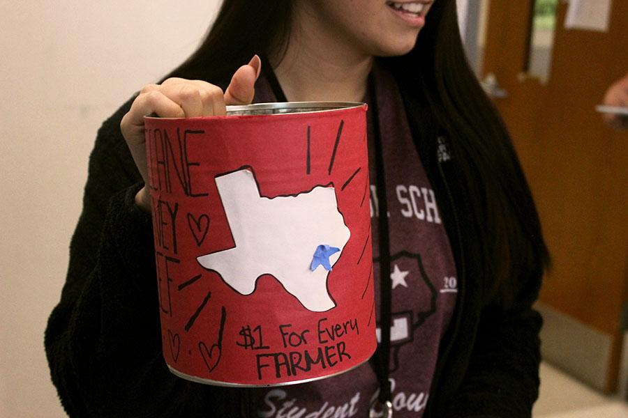Junior Leyla Davydova carries a bucket around to each classroom to collect money for the Hurricane Harvey relief. 